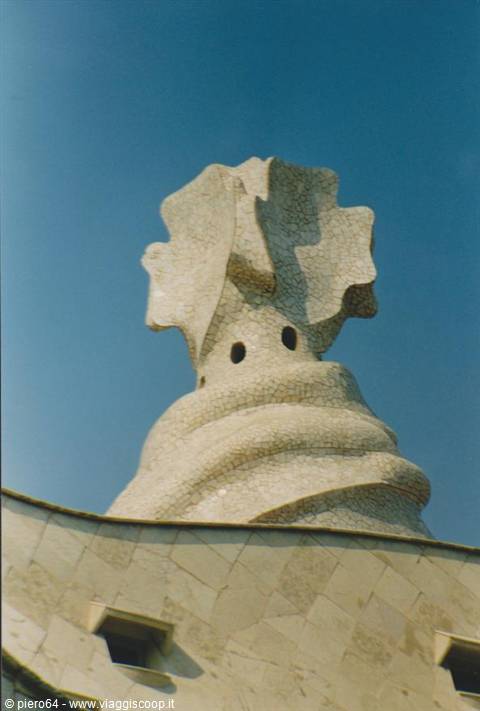 Gaudí's mosaic-covered chimney atop La Pedrera rooftop in Barcelona