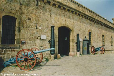 Red-wheeled cannons in front of Montjuïc Castle in Barcelona