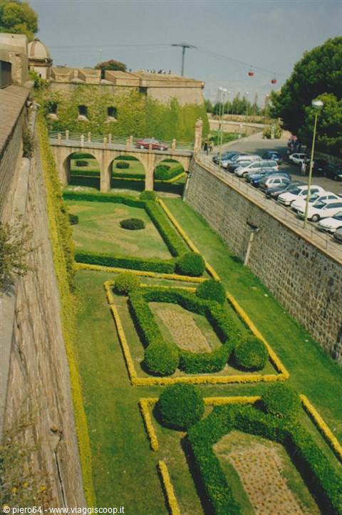 Geometric gardens on Montjuïc walls, aerial cableway above Barcelona