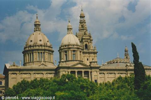 Domes and tower of the National Art Museum of Catalonia among trees, Barcelona