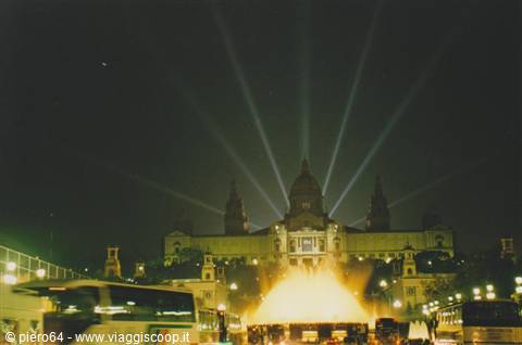 Magic Fountain of Montjuïc lit at night, National Palace behind, Barcelona