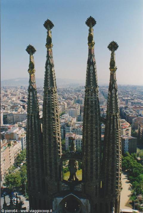 The decorated spires of the Sagrada Família rise above Barcelona rooftops