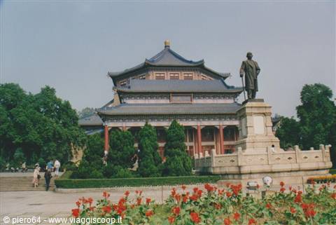 Sun Yat-sen statue in front of the Memorial Hall in Guangzhou, red flowers