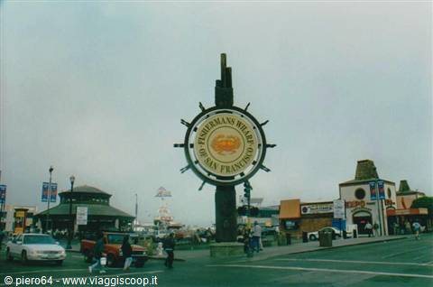 The ship-wheel sign with crab at Fisherman's Wharf, San Francisco