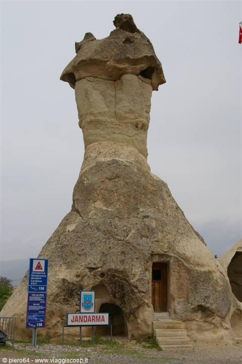 Cappadocia fairy chimney with wooden door and Jandarma sign