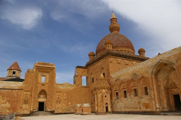 Ishak Pasha Palace in Doğubayazıt: brick dome and mausoleum among stone courtyards