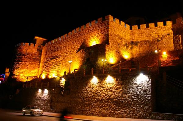 Stone walls of Kastamonu castle illuminated at night