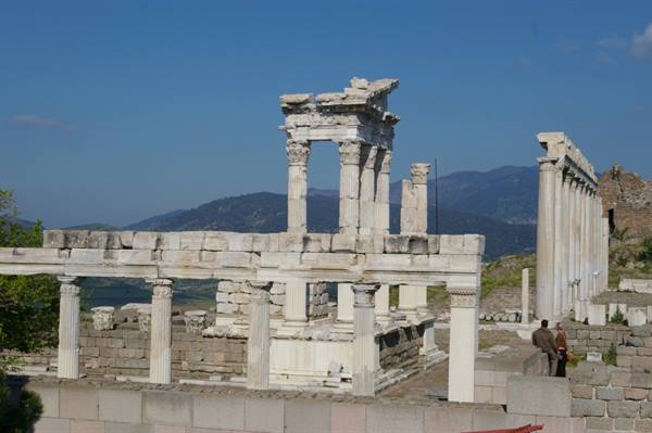 Marble columns of Trajan's Temple at Pergamon, tourists among the ruins