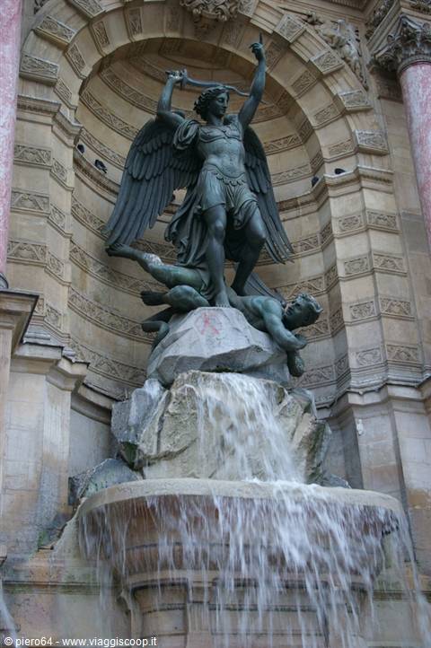 Bronze archangel statue on the Saint-Michel fountain in Paris, flowing water