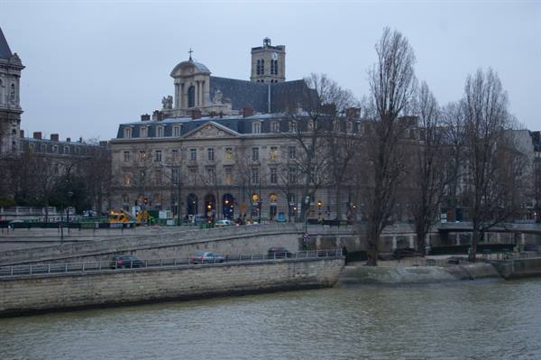 Hôtel-Dieu hospital by the Seine in Paris, grey sky, bare trees