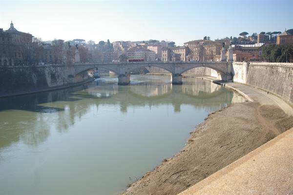 The Tiber in Rome with Ponte Vittorio Emanuele II between travertine embankments