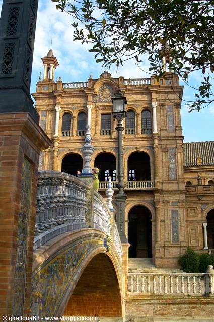Ceramic-decorated bridge and brick palace at Plaza de España, Seville
