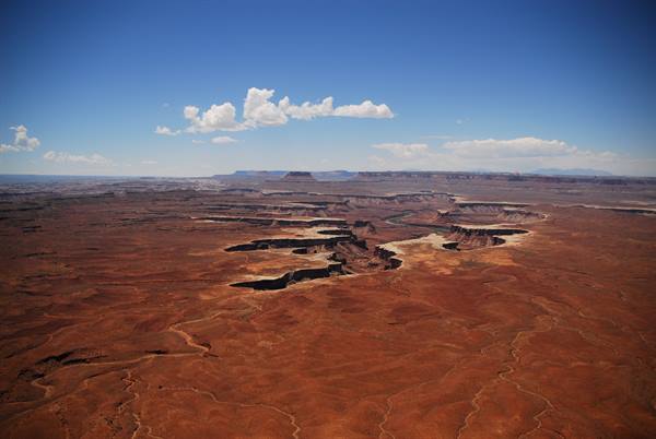 Canyonlands National Park, red canyons carved by the river beneath white clouds