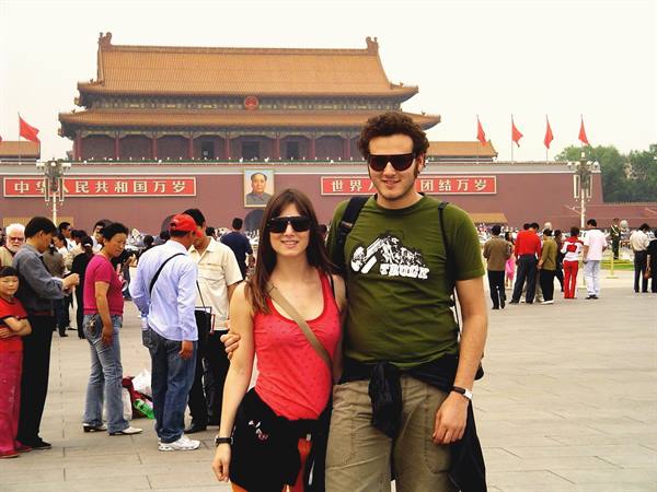 Couple in sunglasses posing in front of Tiananmen Gate, Beijing