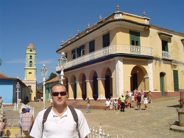 Tourist with backpack in front of San Francisco convent in Trinidad