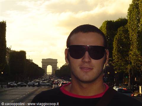 Portrait with sunglasses on the Champs-Élysées, Arc de Triomphe in the background
