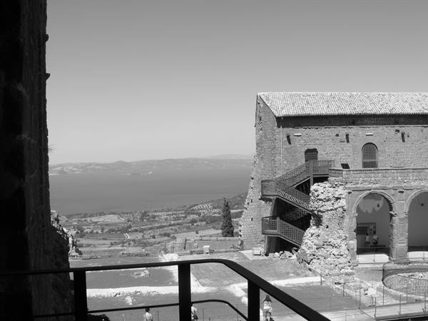 Papal Palace in Viterbo, stone loggia with external staircase, Lake Bolsena beyond