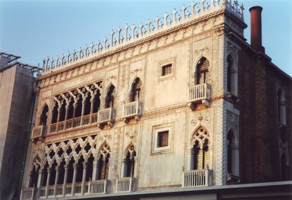 Gothic marble facade of Ca' d'Oro in Venice, warm evening light