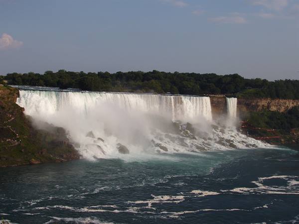 Niagara Falls, white water plunging into misty river below