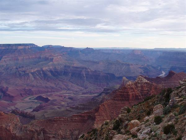 The Grand Canyon with the Colorado River winding through red rock layers