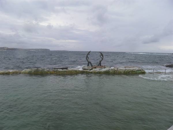 Bronze arch sculptures on the rock above Fairy Bower ocean pool, Manly