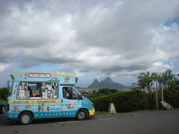 Blue ice cream van parked, Trois Mamelles mountains of Mauritius behind