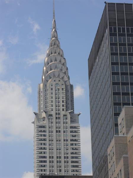 Stainless steel art deco spire of the Chrysler Building among Manhattan skyscrapers