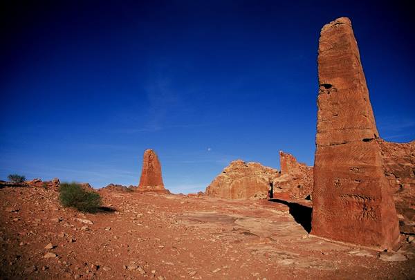 Red rock pillars rising in Timna desert, deep blue sky overhead