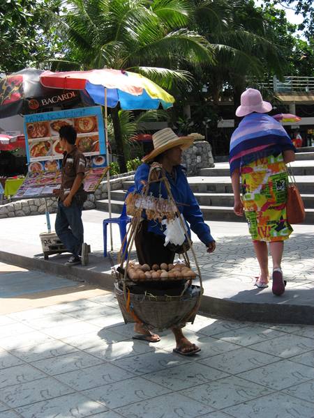 street vendor in Patong with eggs over the embers..