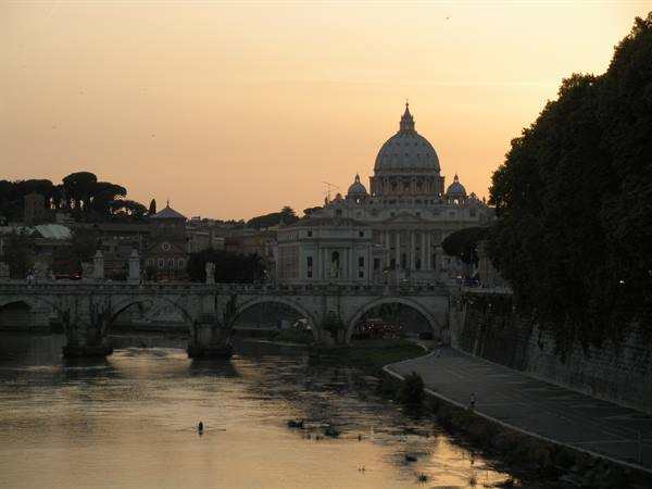 St. Peter's dome and bridge over the Tevere river, Rome, warm light