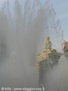 Water jets of Cibeles fountain with the Banco building behind