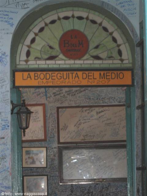 La Bodeguita del Medio sign with stained glass, graffiti-covered walls and lantern