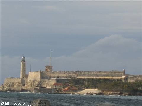 The Morro lighthouse and stone fortress rise above Havana's waves