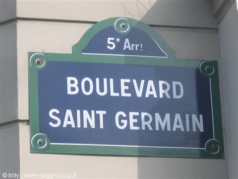 Blue and green enamel street sign reading Boulevard Saint Germain, Paris