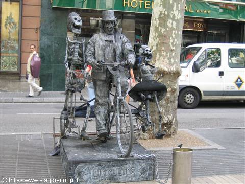 Metal statue of a cyclist with skeletons on Las Ramblas, Barcelona