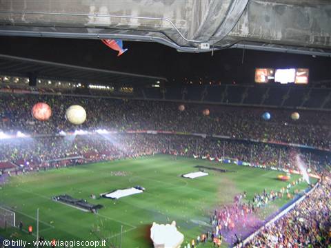 Camp Nou stadium at night, floodlit pitch packed with spectators