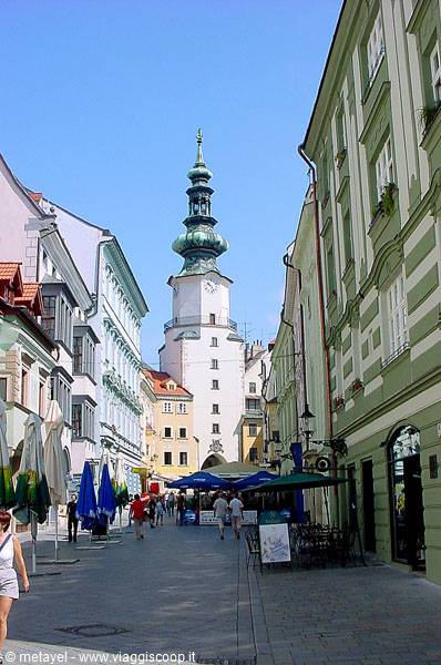 Pedestrian street with café umbrellas toward St. Michael's Gate tower, Bratislava