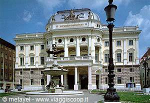 Fountain in front of Bratislava National Theatre, neorenaissance facade and lamppost