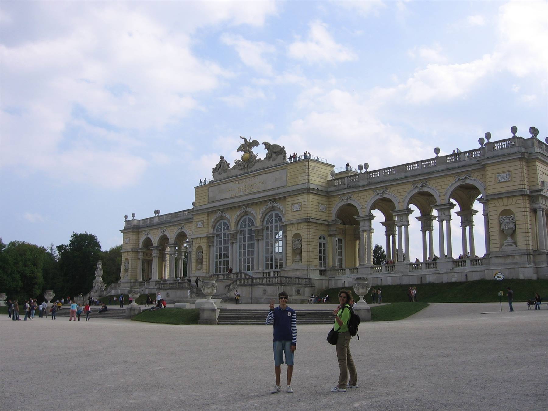 The Gloriette at Schönbrunn, two tourists pose on the gravel square