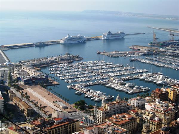 Alicante harbor: sailboats moored and two ferries near the pier