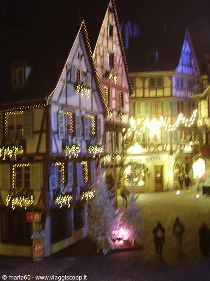 Timbered houses decorated with Christmas lights in Colmar at night