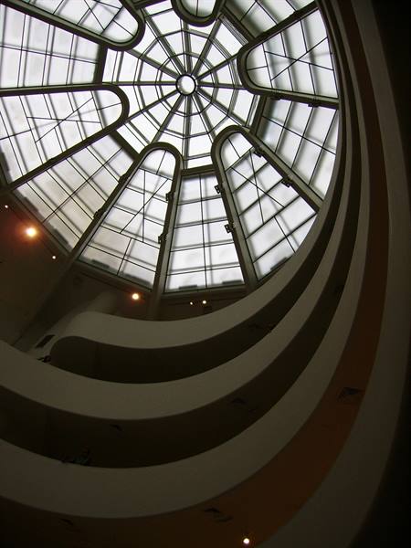 Looking up at the Guggenheim New York glass dome above the curved ramps