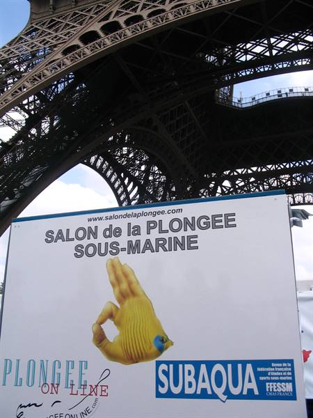 Salon de la Plongée Sous-Marine sign beneath the Eiffel Tower iron lattice
