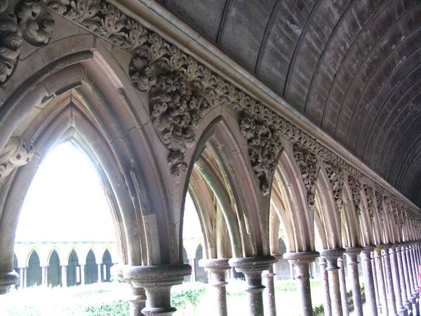 Gothic cloister with carved arches and wooden vault, Mont-Saint-Michel Abbey