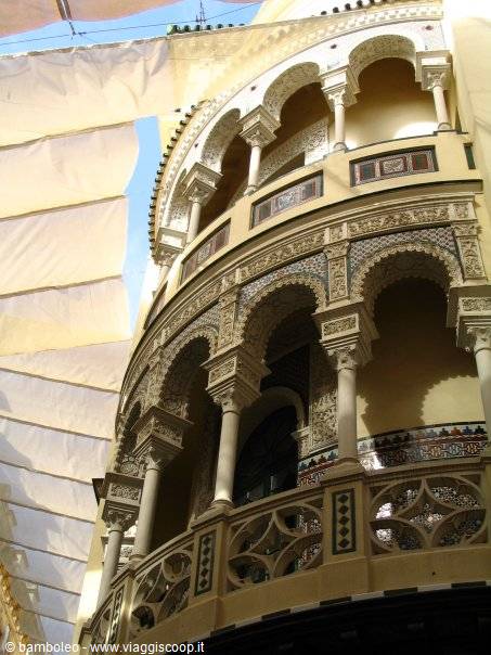 Mudejar-style facade with arches and ceramics, Hotel Alfonso XIII in Seville