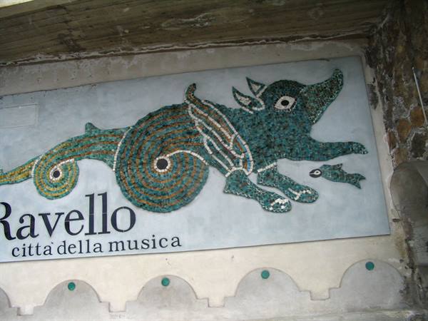 Animal-shaped mosaic on the Ravello city of music sign