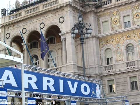 Genoa's Palazzo della Borsa with EU flag and Arrivo banner on scaffolding