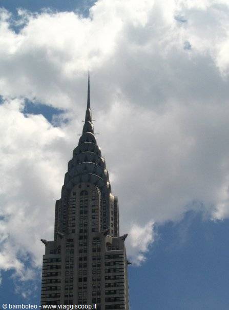 Steel Art Deco spire of the Chrysler Building among clouds in New York