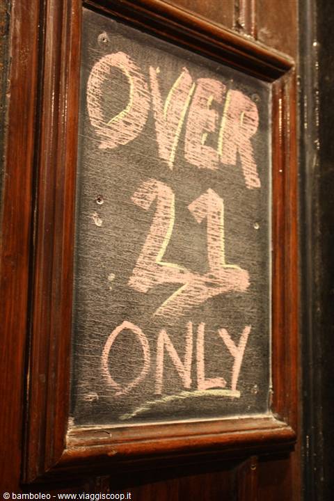 Chalkboard sign reading Over 21 Only, framed in dark wood