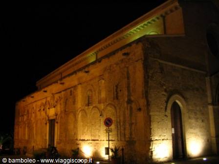 Romanesque stone church illuminated at night in Lucca, San Pier Somaldi